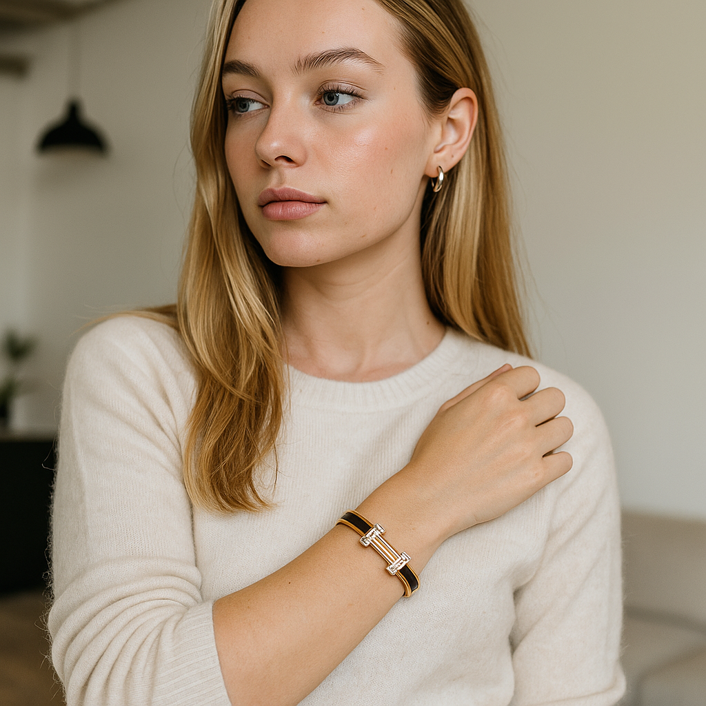 Woman wearing a gold bracelet and looking away from the camera